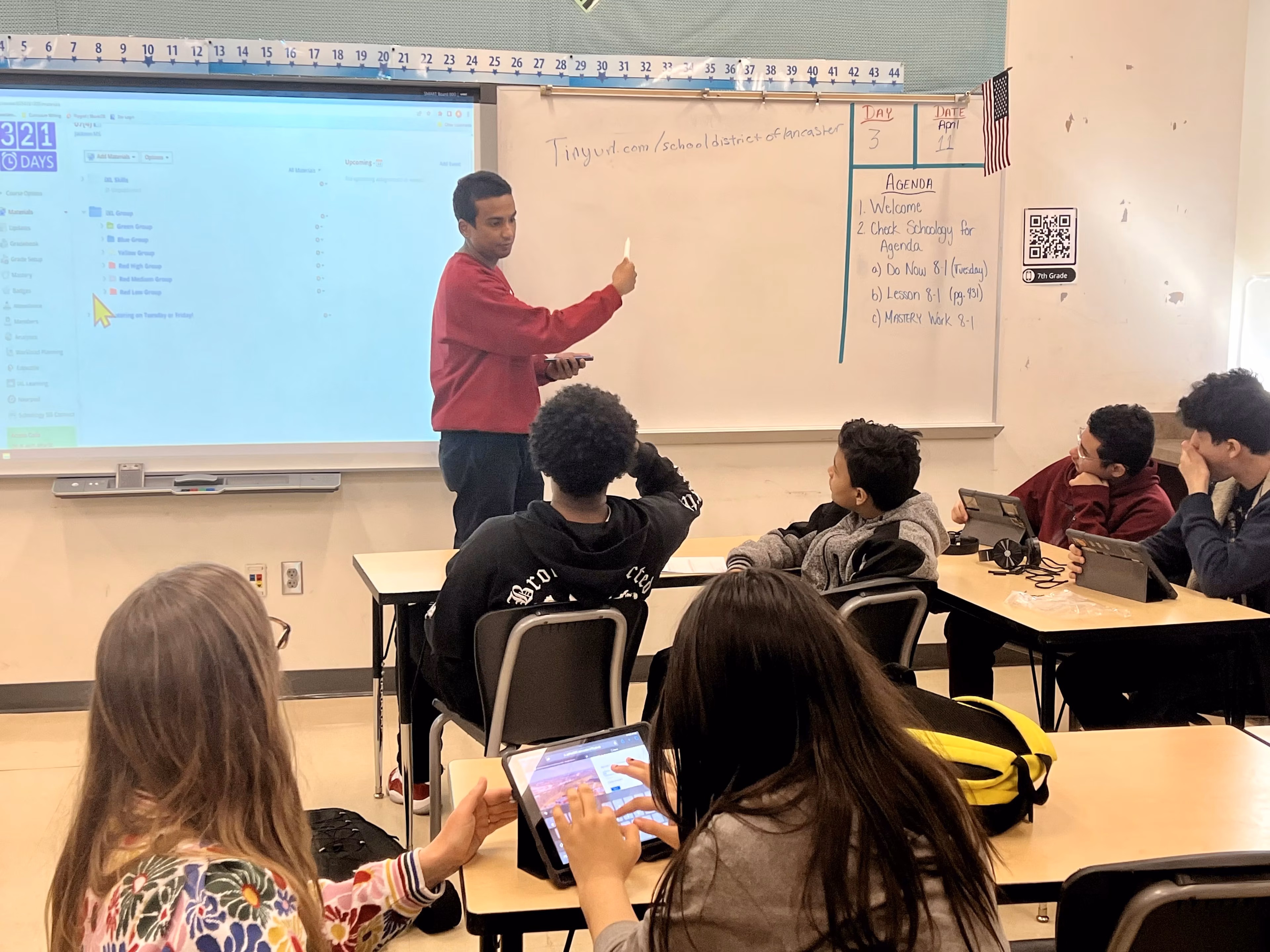 Classroom session with students and teacher, representing community-centered learning