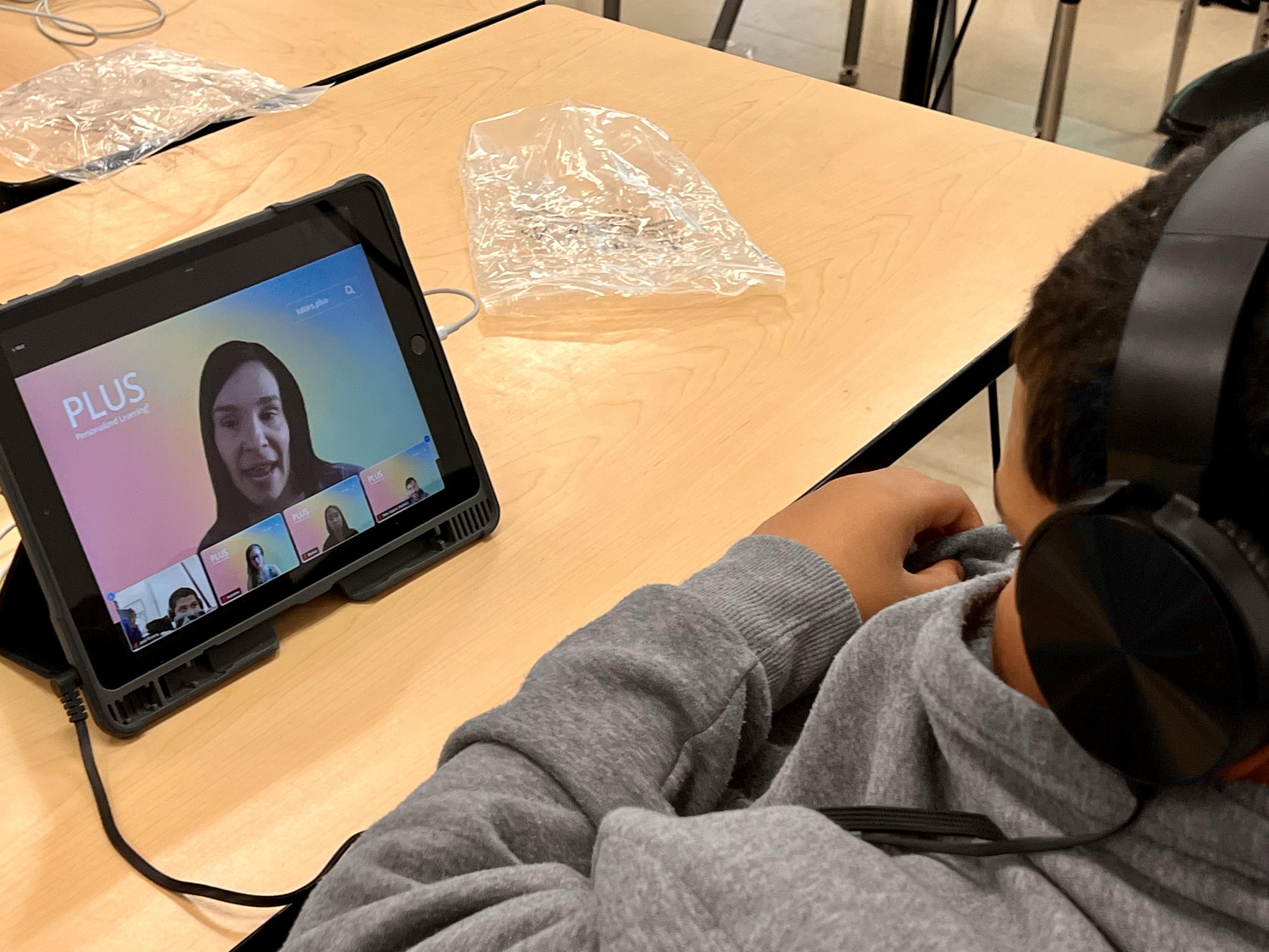 Tutor working with a student during a PLUS session